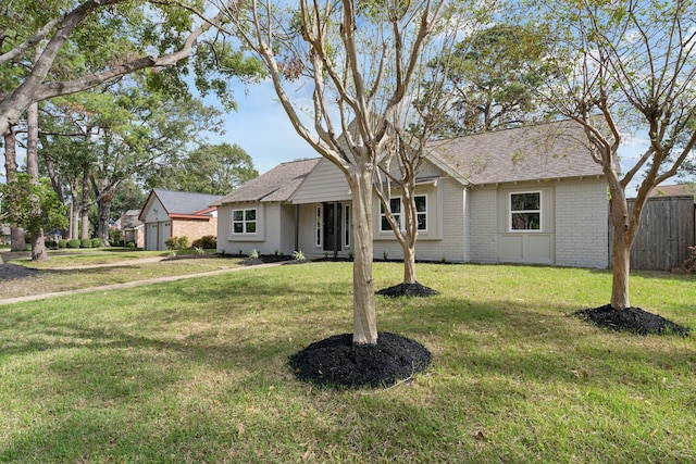 ranch-style home with a front yard