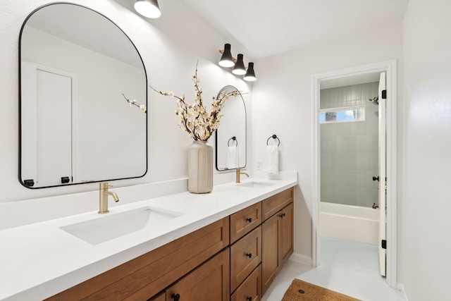 bathroom featuring vanity and tiled shower / bath combo