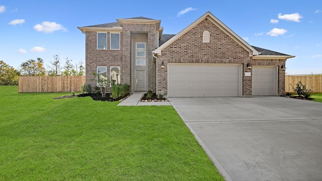 view of front property featuring a front yard and a garage