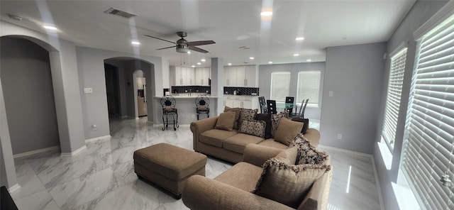 living room featuring ceiling fan