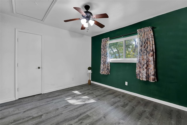 empty room featuring hardwood / wood-style flooring and ceiling fan