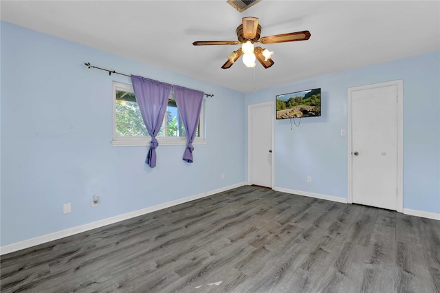 unfurnished room featuring ceiling fan and wood-type flooring