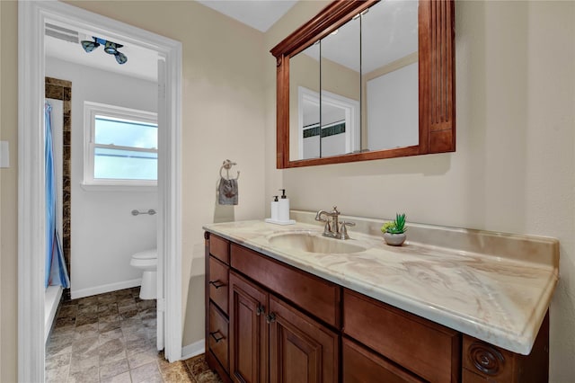 bathroom with vanity and toilet