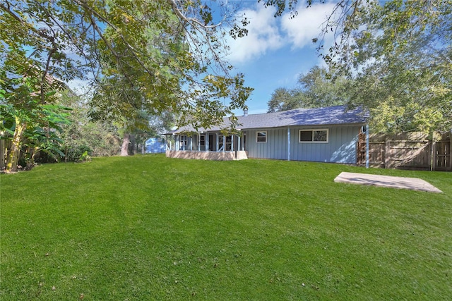 view of yard featuring a sunroom