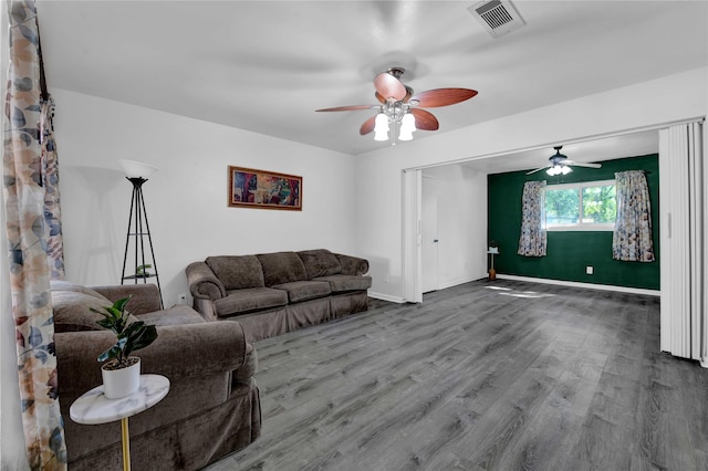 living room with hardwood / wood-style floors and ceiling fan