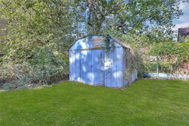 view of outdoor structure with a yard