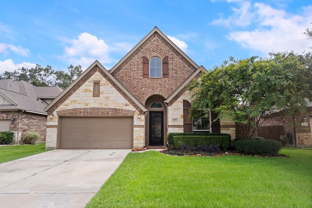 view of front of house featuring a garage and a front lawn