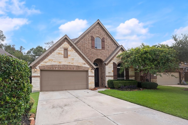 view of front of home with a garage and a front yard