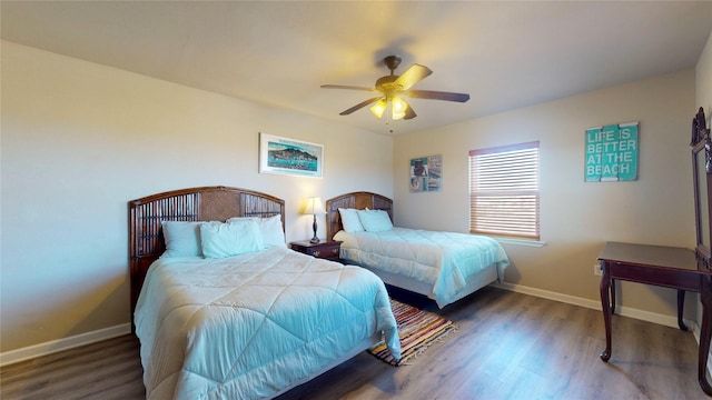 bedroom featuring ceiling fan and dark wood-type flooring