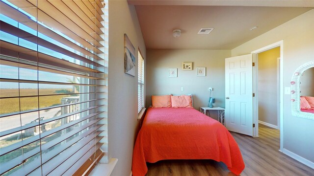 bedroom with wood-type flooring