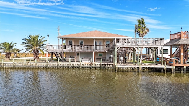 back of property with a water view