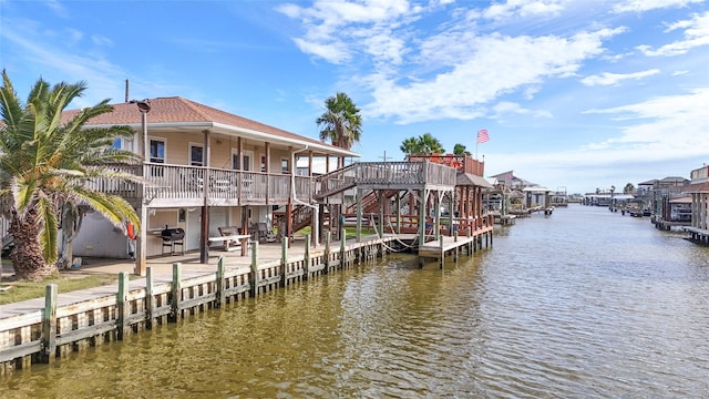 dock area featuring a deck with water view