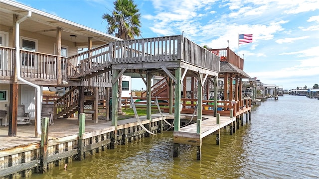 dock area featuring a deck with water view