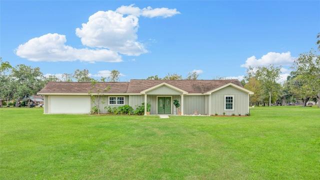 single story home with a garage and a front yard