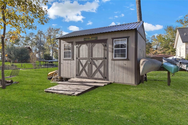 view of outdoor structure with a lawn