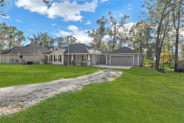 ranch-style house featuring a front lawn, a porch, and a garage