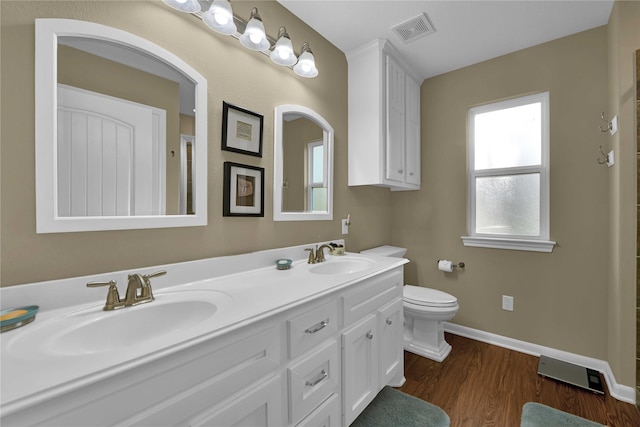 bathroom featuring hardwood / wood-style floors, vanity, and toilet