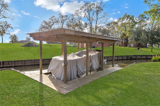 dock area featuring a water view and a yard