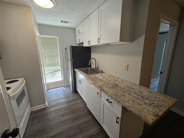 kitchen featuring white cabinets, white appliances, dark wood-type flooring, and sink