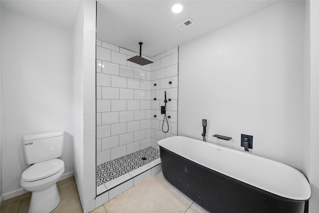 bathroom with tile patterned floors, separate shower and tub, and toilet