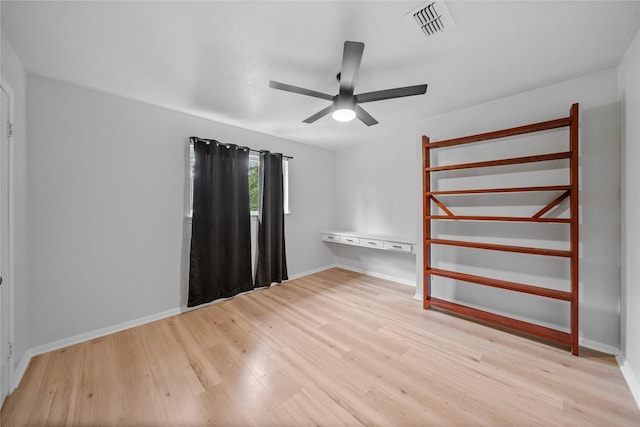 unfurnished bedroom with light hardwood / wood-style floors and ceiling fan