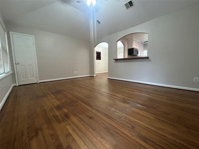 unfurnished living room featuring dark hardwood / wood-style flooring