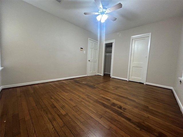 unfurnished bedroom featuring dark hardwood / wood-style floors and ceiling fan