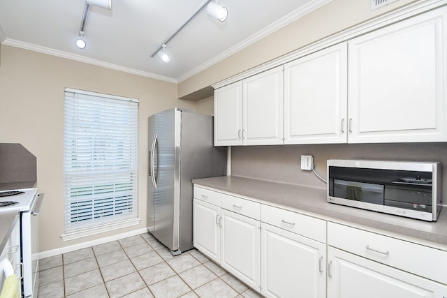 kitchen with rail lighting, stainless steel appliances, white cabinetry, and ornamental molding