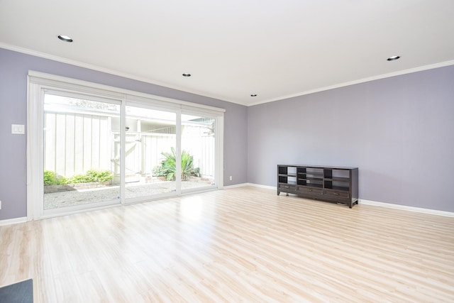 unfurnished room featuring light hardwood / wood-style floors and crown molding