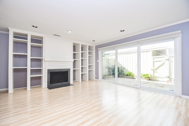 unfurnished living room with light hardwood / wood-style floors and ornamental molding