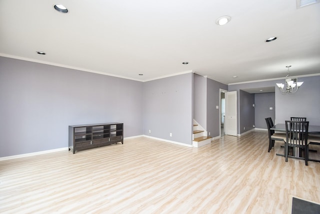 living room featuring an inviting chandelier, ornamental molding, and light hardwood / wood-style flooring