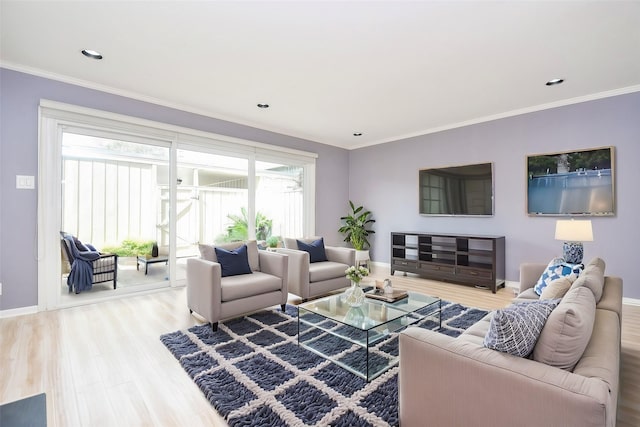 living room with wood-type flooring and ornamental molding