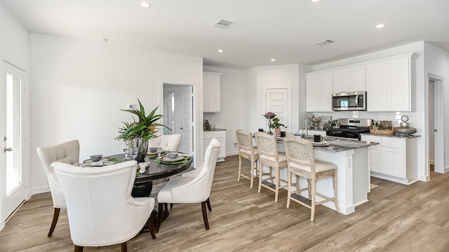 dining room with light hardwood / wood-style floors