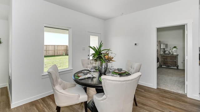 dining room with dark wood-type flooring