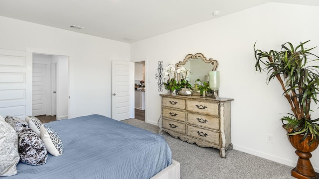 bedroom with carpet and vaulted ceiling