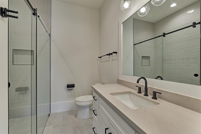 bathroom with an enclosed shower, vanity, toilet, and tile patterned floors