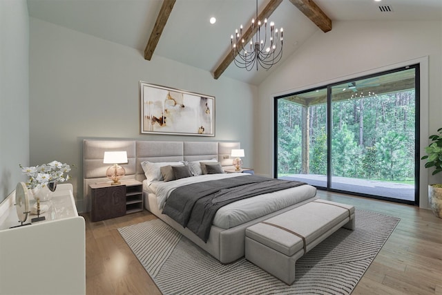 bedroom featuring light hardwood / wood-style flooring, access to outside, and multiple windows