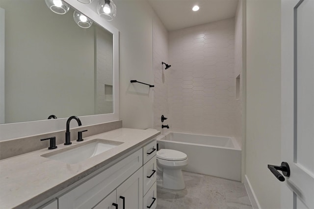 full bathroom featuring vanity, toilet, and tiled shower / bath