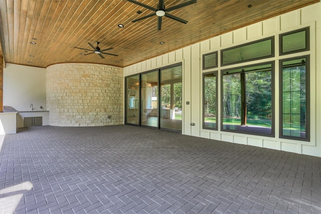 view of patio with area for grilling and ceiling fan