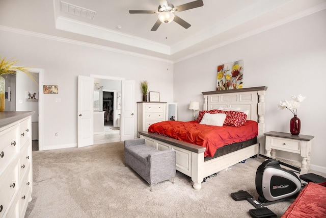 bedroom featuring a raised ceiling, ceiling fan, crown molding, and light colored carpet