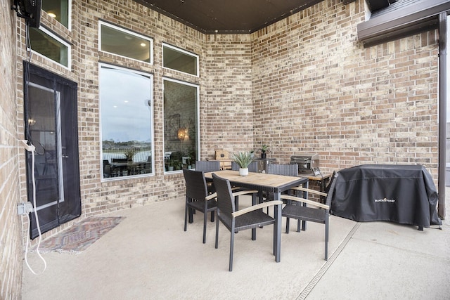 view of patio featuring a grill