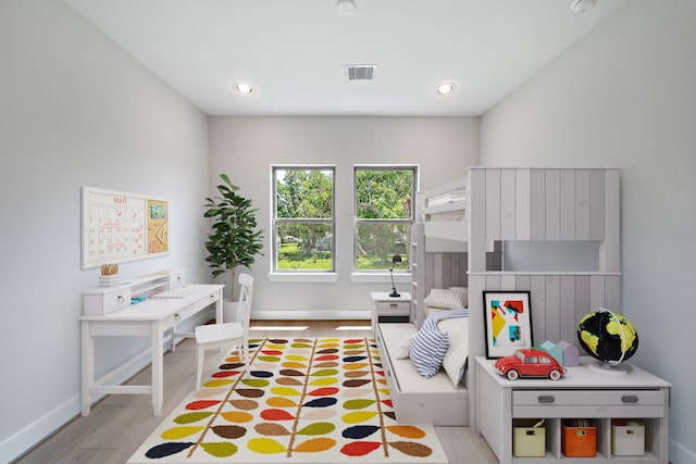 recreation room with light hardwood / wood-style floors