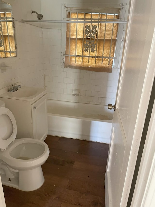 full bathroom with vanity,  shower combination, toilet, tasteful backsplash, and wood-type flooring