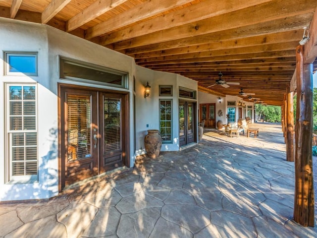 view of patio / terrace featuring ceiling fan and french doors