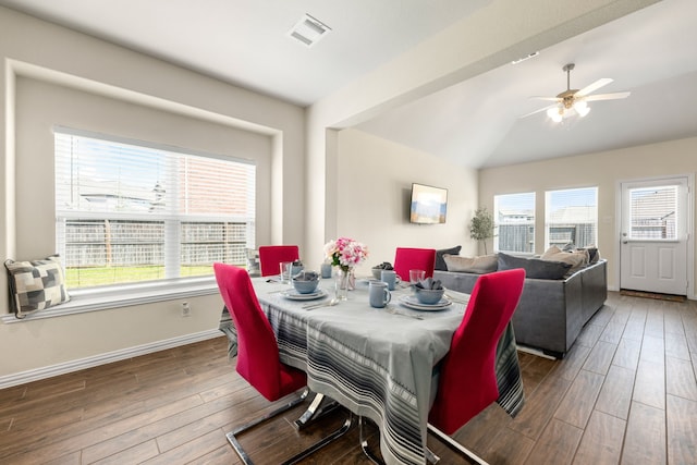 dining room featuring ceiling fan, dark hardwood / wood-style flooring, and a healthy amount of sunlight