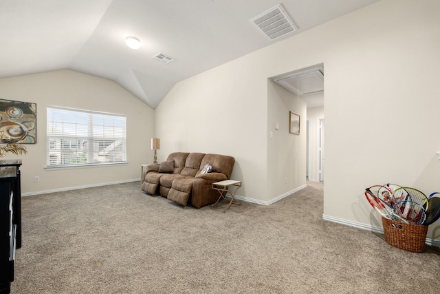 living area with lofted ceiling and light carpet