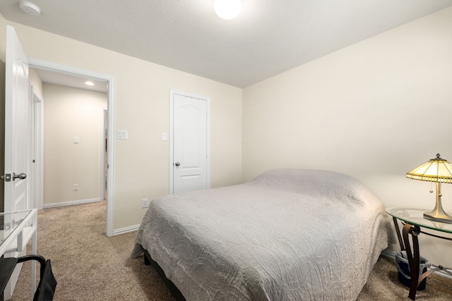 bedroom with carpet floors and a closet