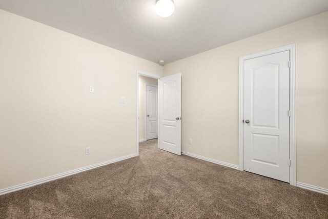 unfurnished bedroom featuring carpet floors