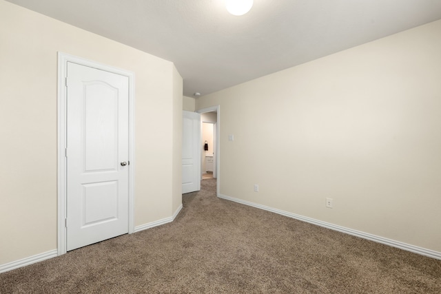 unfurnished bedroom featuring carpet flooring