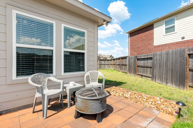 view of patio / terrace with a fire pit